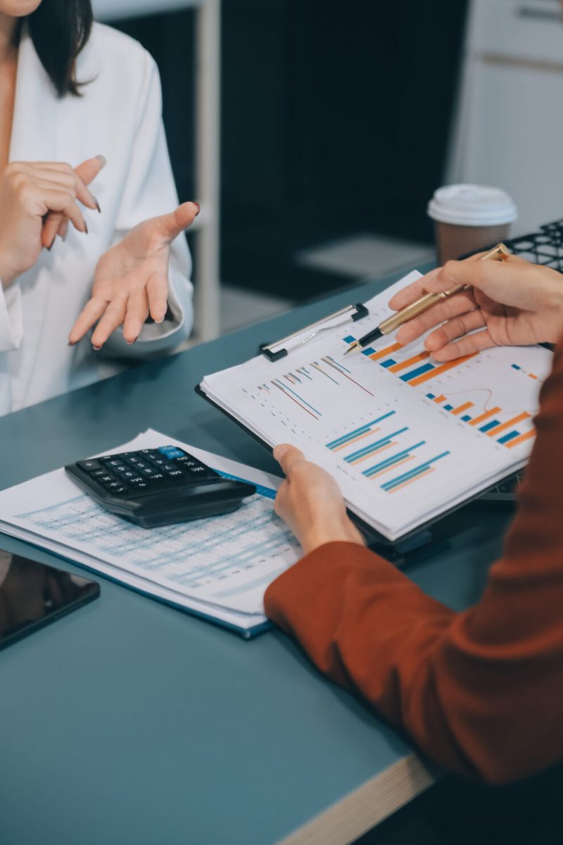 Business team working with new startup project plan and discussion information for financial strategy with laptop and digital tablet in a modern business lounge.